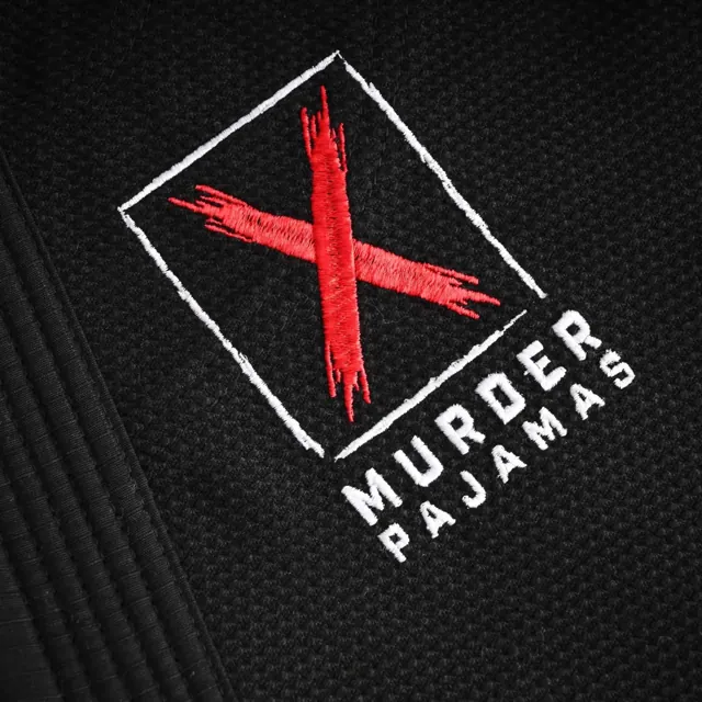 Embroidered X logo on the black gi
